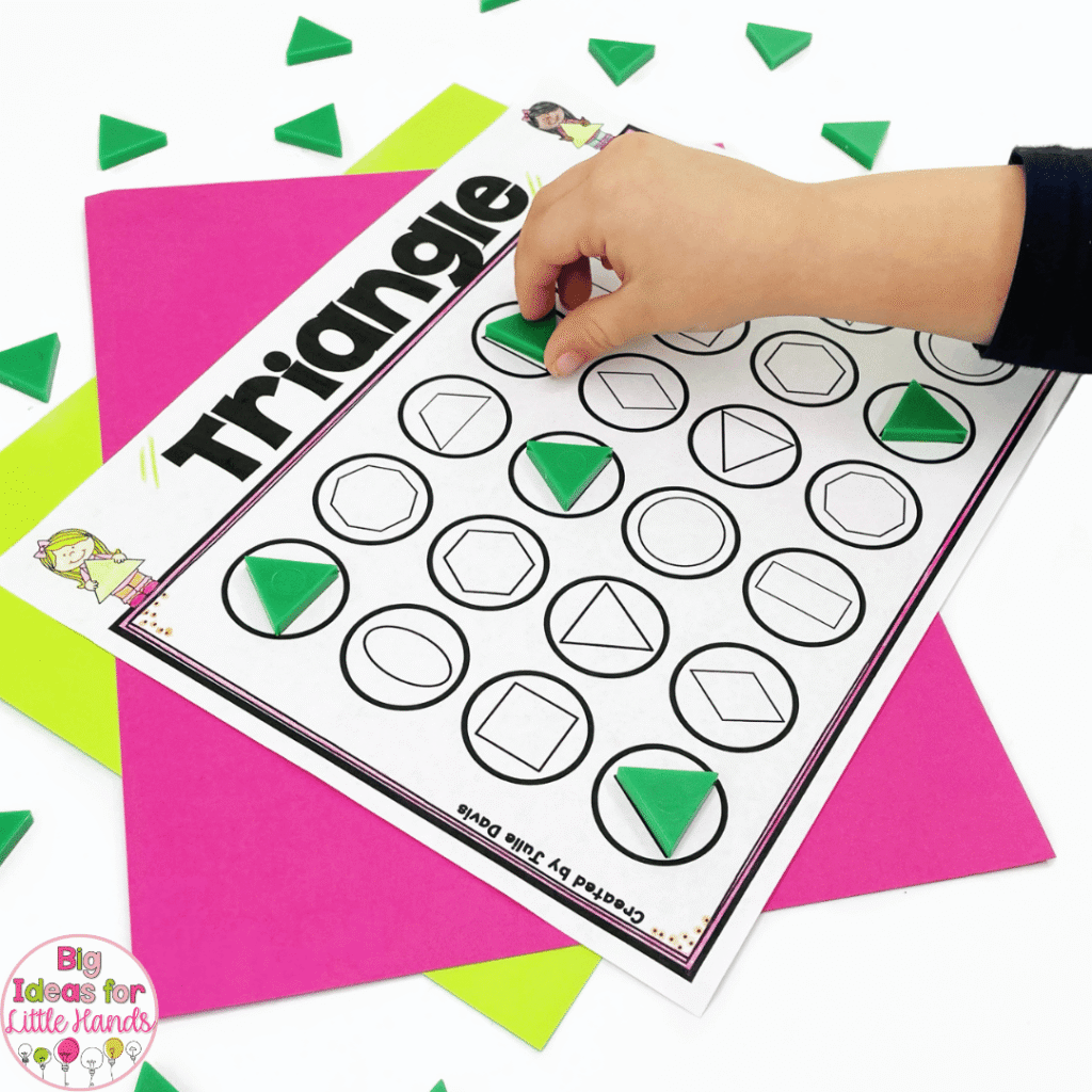 This photo shows a student finding and covering triangles.